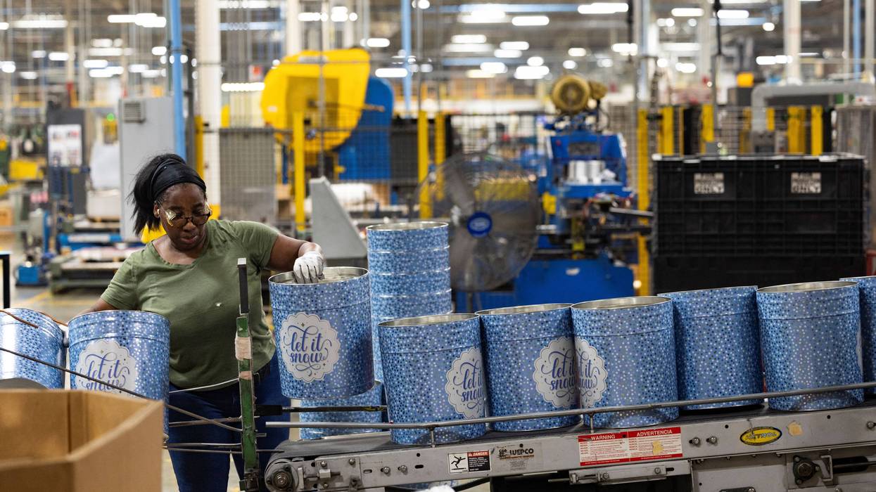 A woman works at a can company.