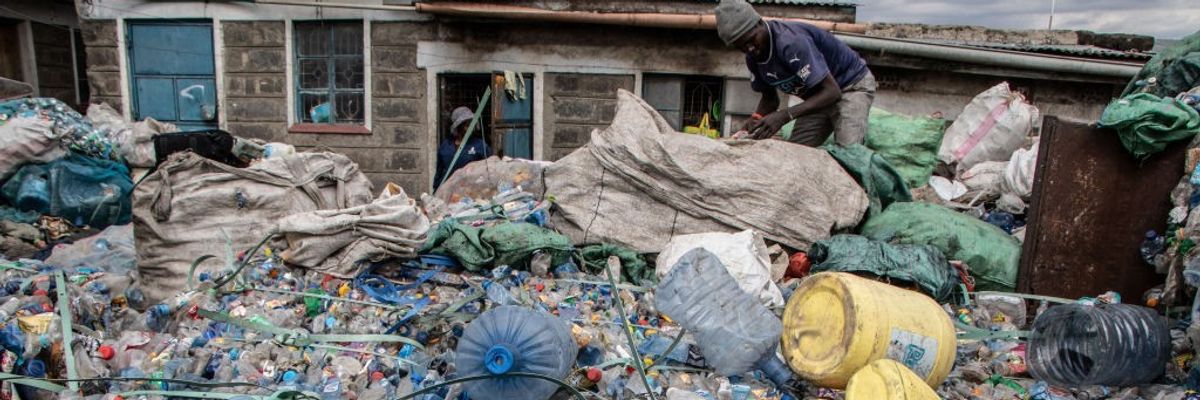 A worker is seen working at a plastic recycling center