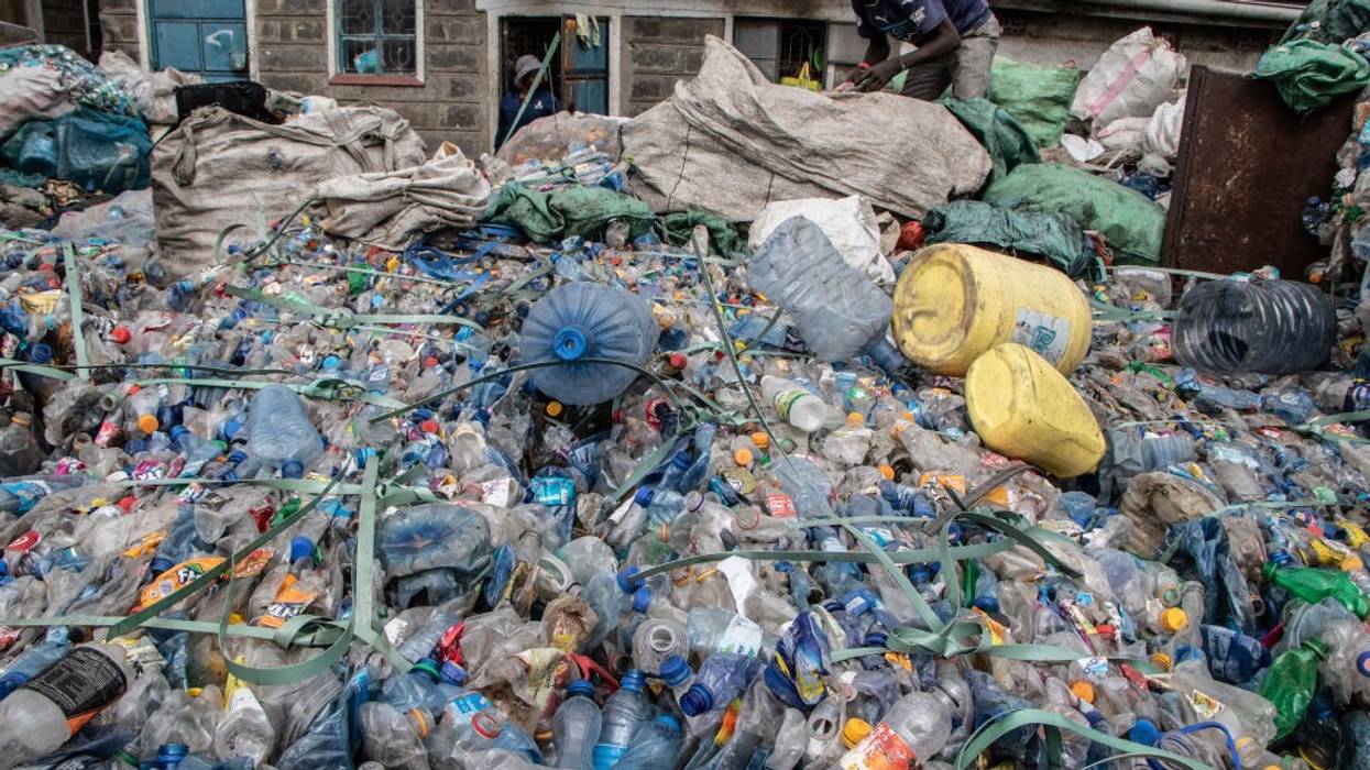 A worker is seen working at a plastic recycling center