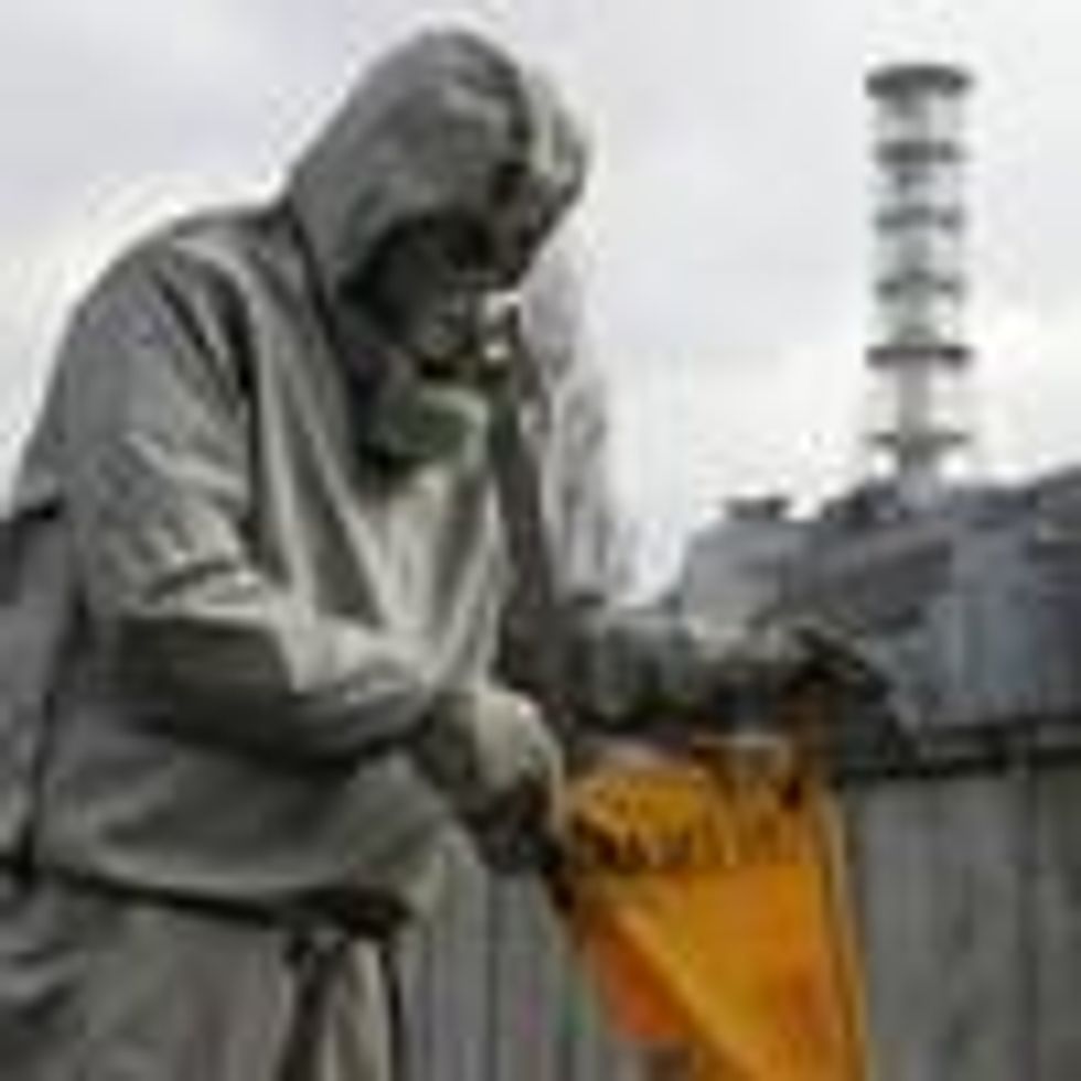 A worker sets a flag signaling radioactivity in front of the Chernobyl nuclear power plant during a drill organized by Ukraine's Emergency Ministry on November 8, 2006.