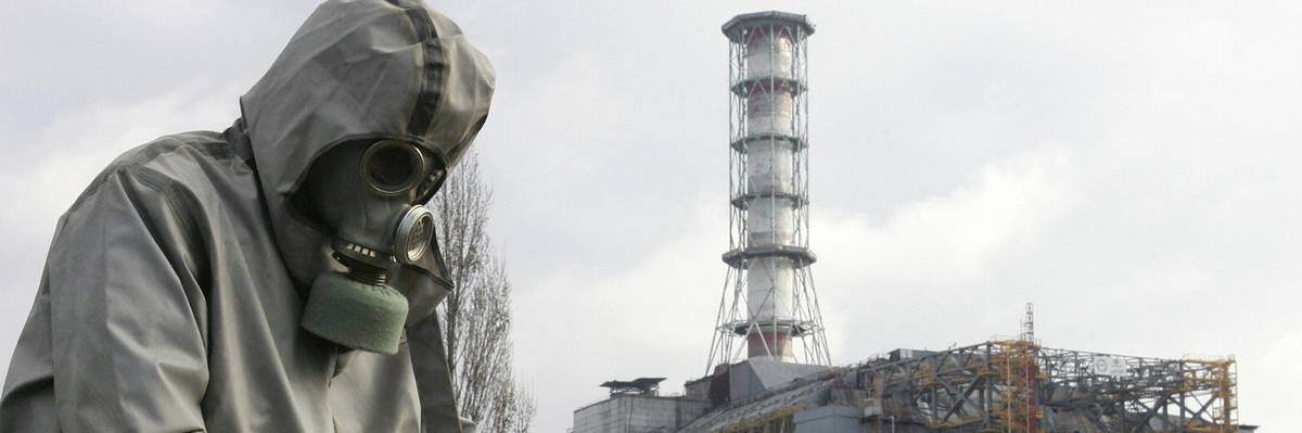 A worker sets a flag signaling radioactivity in front of the Chernobyl nuclear power plant during a drill organized by Ukraine's Emergency Ministry on November 8, 2006.