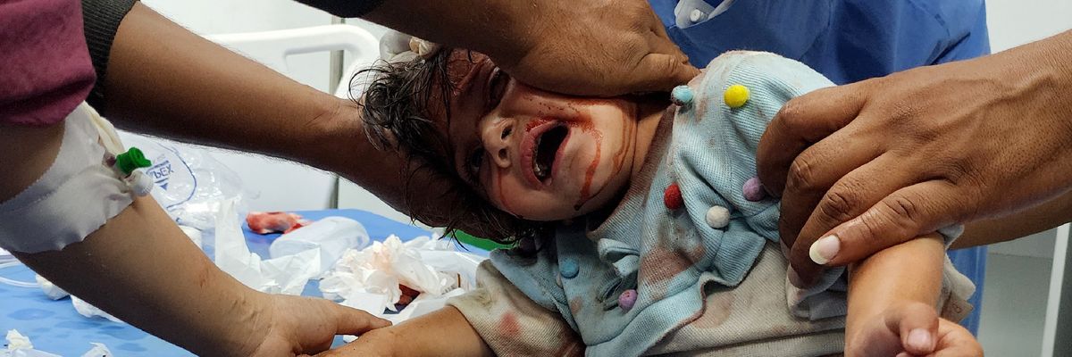 A wounded child is brought to UAE Hospital in Rafah after Israel bombed tents full of displaced Gazans, killing at least 45 and severely wounding hundreds