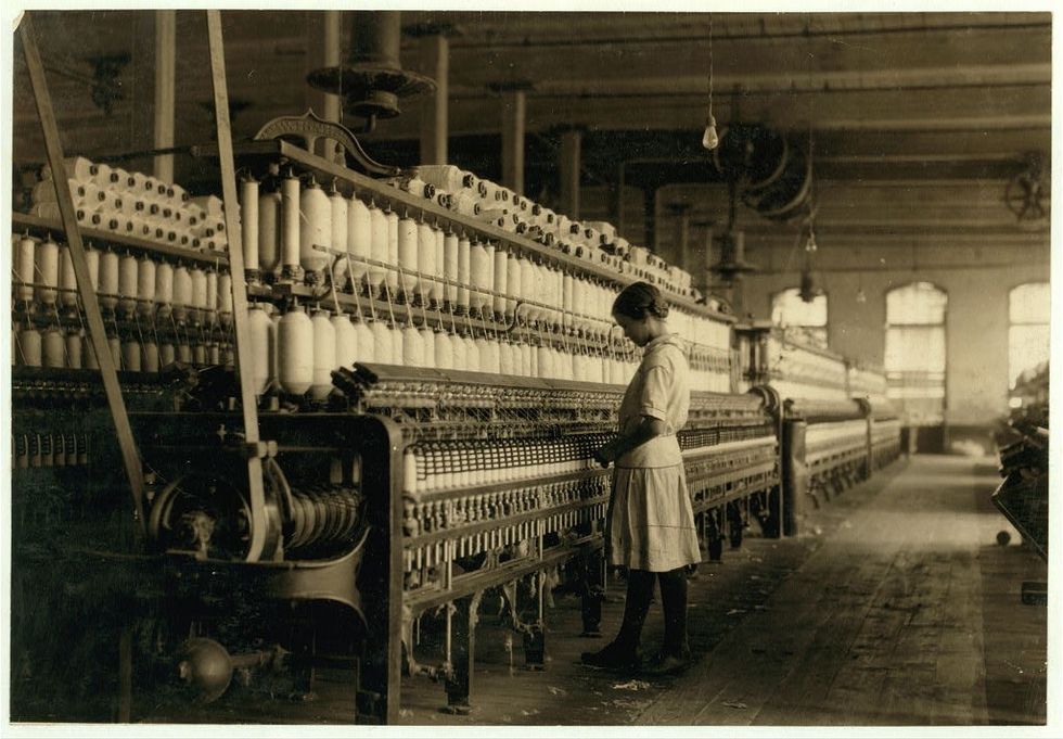 A young girl spinning.