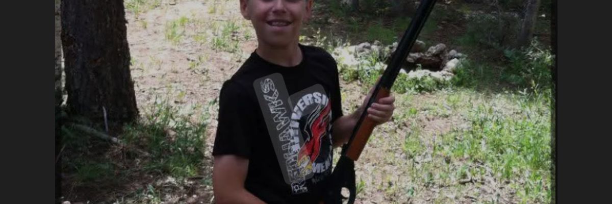 A young Tyler Robinson with one of his many guns