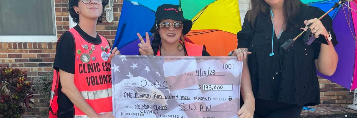 Abortion clinic escorts deliver a check for $193,000 to the Center of Orlando for Women