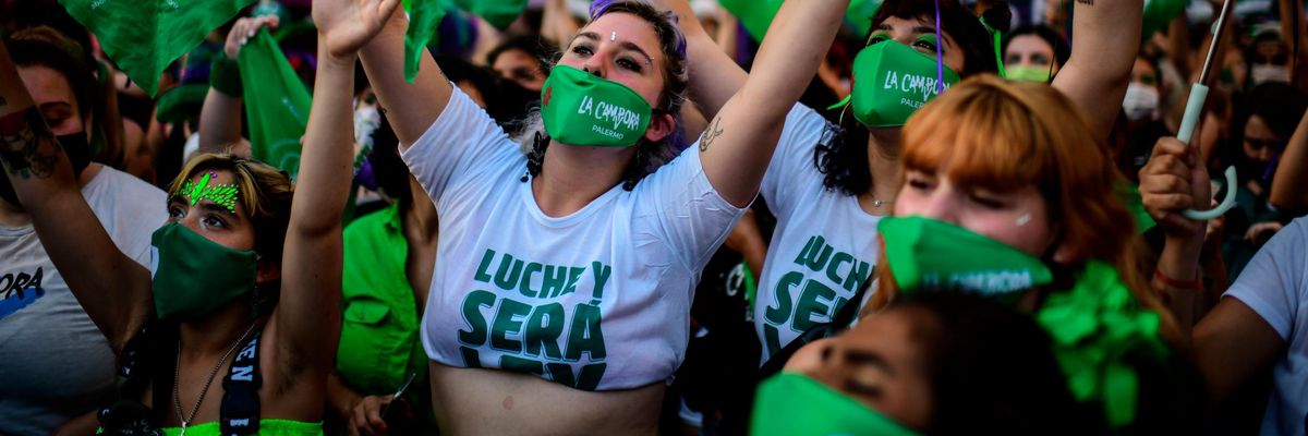 Abortion rights activists demonstrate outside the Congress as senators debate a landmark bill on whether to legalize abortion in Buenos Aires, on December 29, 2020