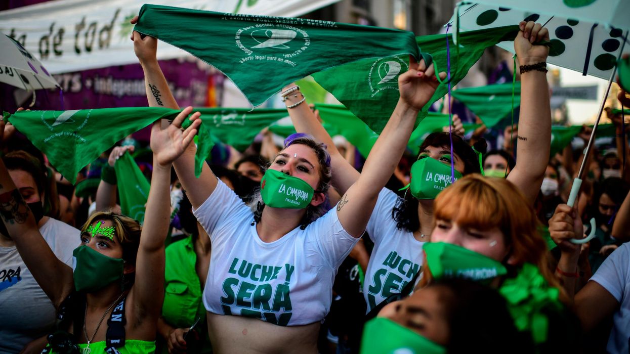 Abortion rights activists demonstrate outside the Congress as senators debate a landmark bill on whether to legalize abortion in Buenos Aires, on December 29, 2020