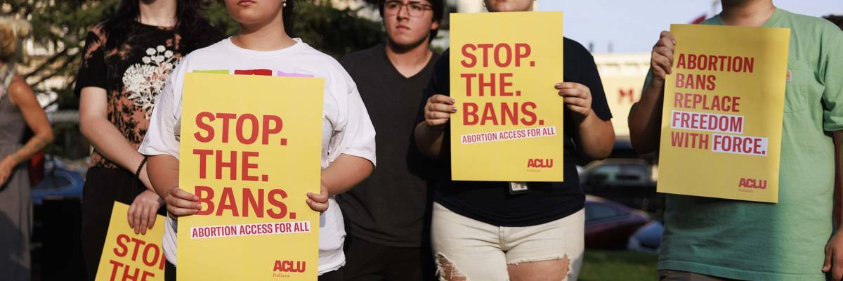 Abortion rights activists gather at the Monroe County Courthouse in Bloomington, Indiana