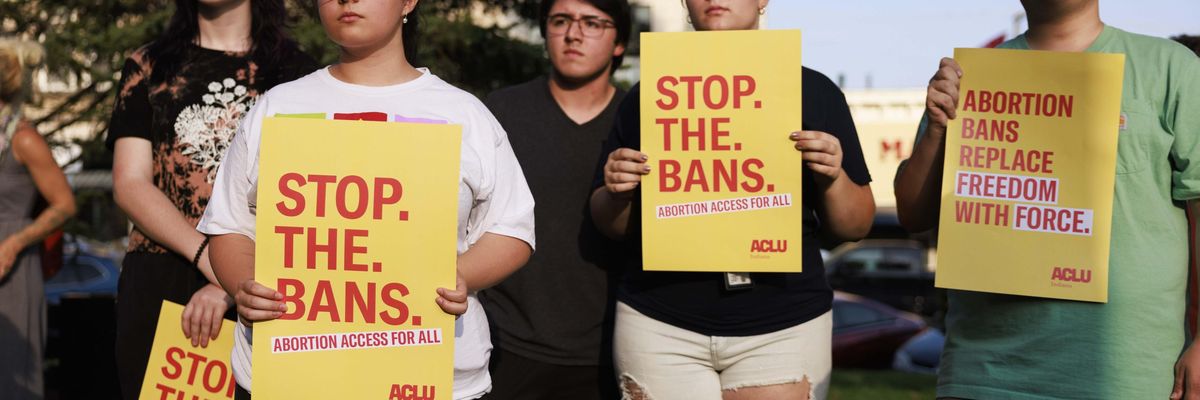 Abortion rights activists gather at the Monroe County Courthouse in Bloomington, Indiana