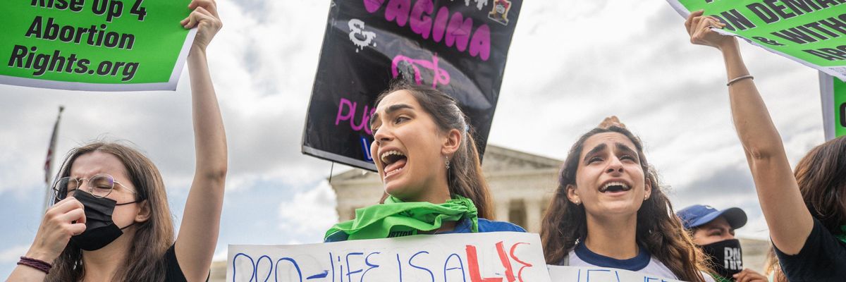 Abortion rights activists react to the Dobbs v Jackson Women's Health Organization ruling in front of the U.S. Supreme Court on June 24, 2022 in Washington, DC.