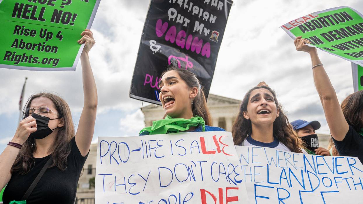 Abortion rights activists react to the Dobbs v Jackson Women's Health Organization ruling in front of the U.S. Supreme Court on June 24, 2022 in Washington, DC.