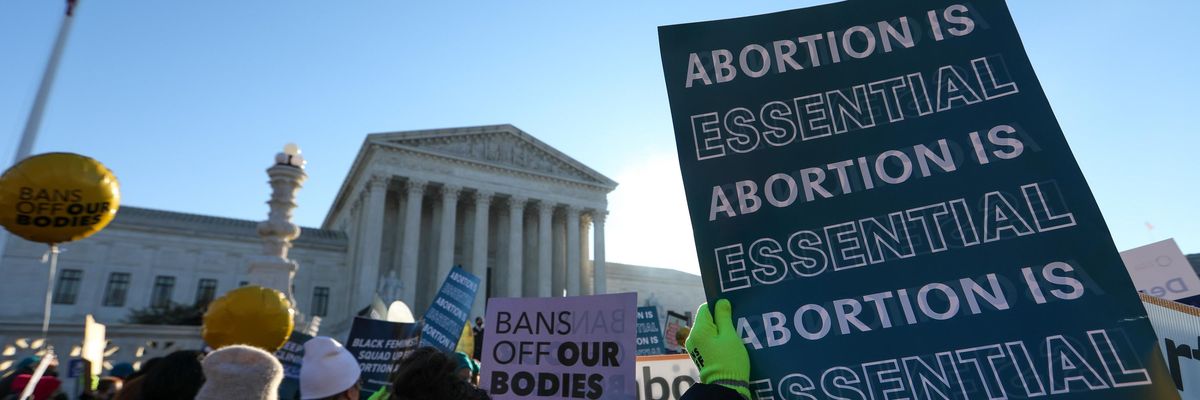 Abortion rights advocates demonstrate in front of the Supreme Court