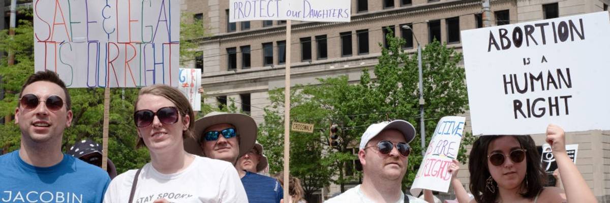 Abortion rights defenders attend a rally in Dayton, Ohio