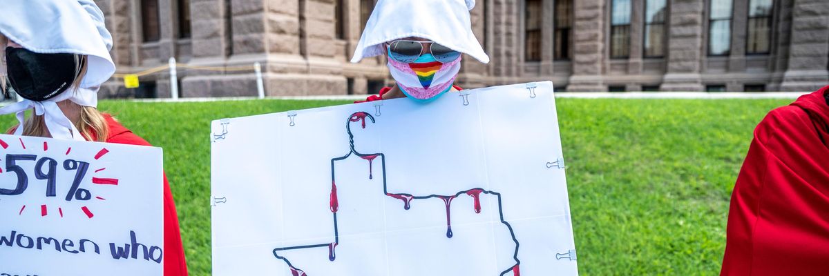 Abortion rights protesters dressed as handmaids in Texas.