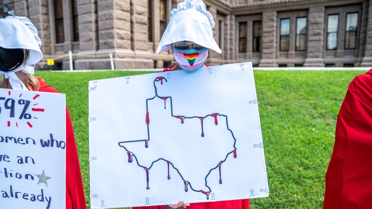 Abortion rights protesters dressed as handmaids in Texas.