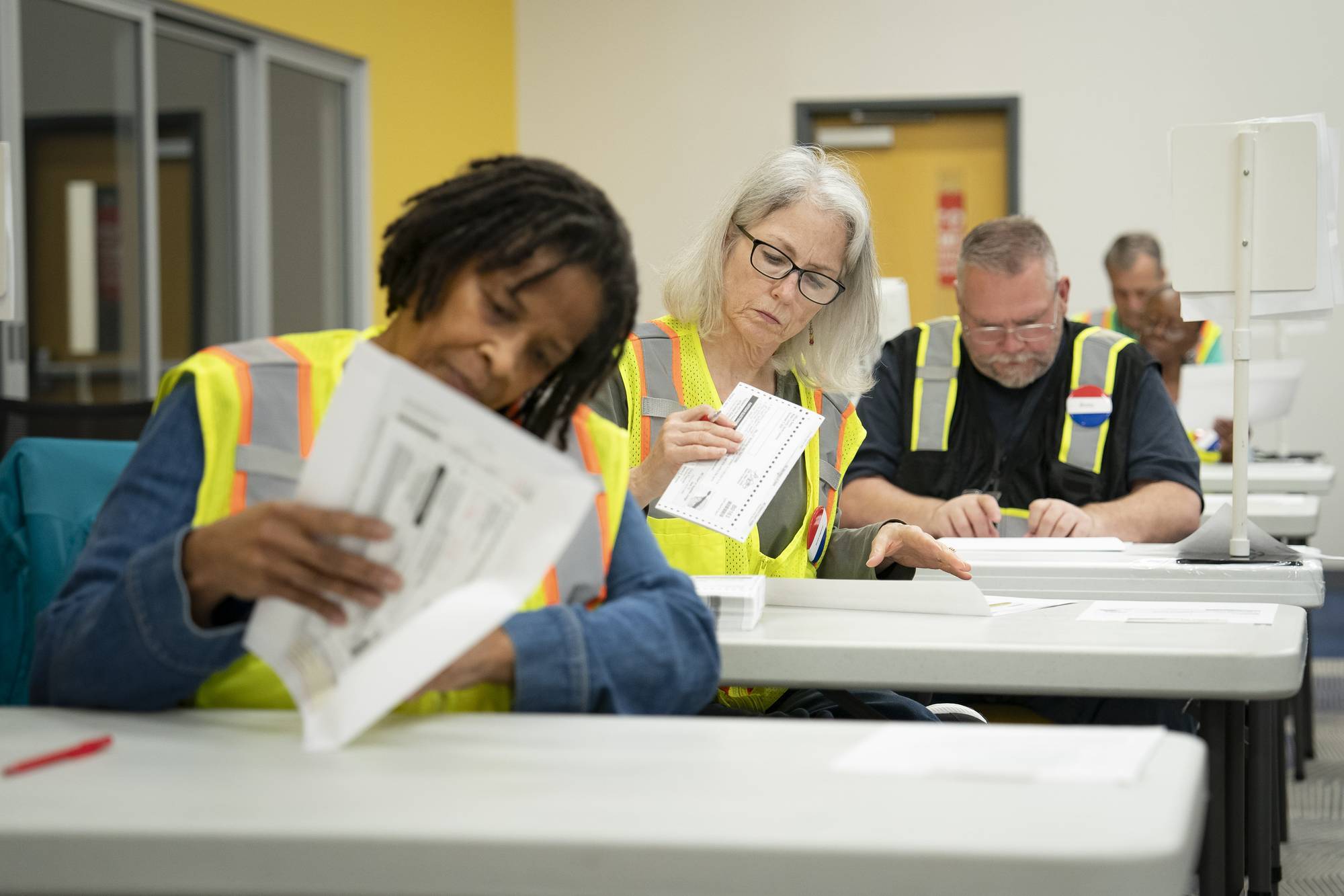 Absentee ballots are prepared to be mailed at the Wake County Board of Elections