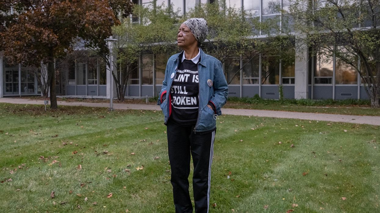 Activist Claire McClinton, wearing a "Flint Is Still Broken" shirt, stands outside of City Hall in Flint, Michigan on October 20, 2020.