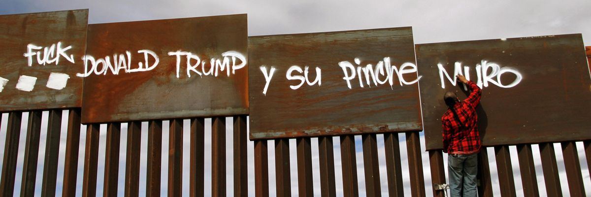 Activist paints "Fuck Donald Trump" on US border fence