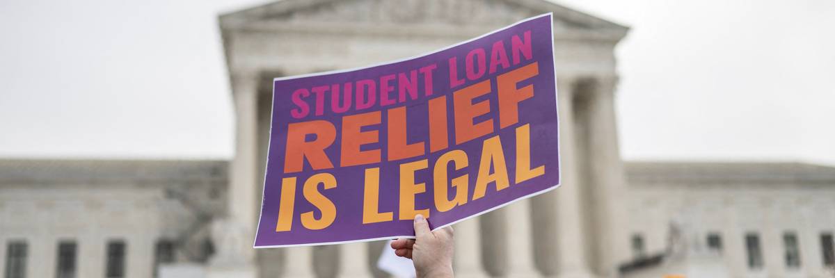 Activists and students protest in front of the Supreme Court during a rally for student debt cancellation