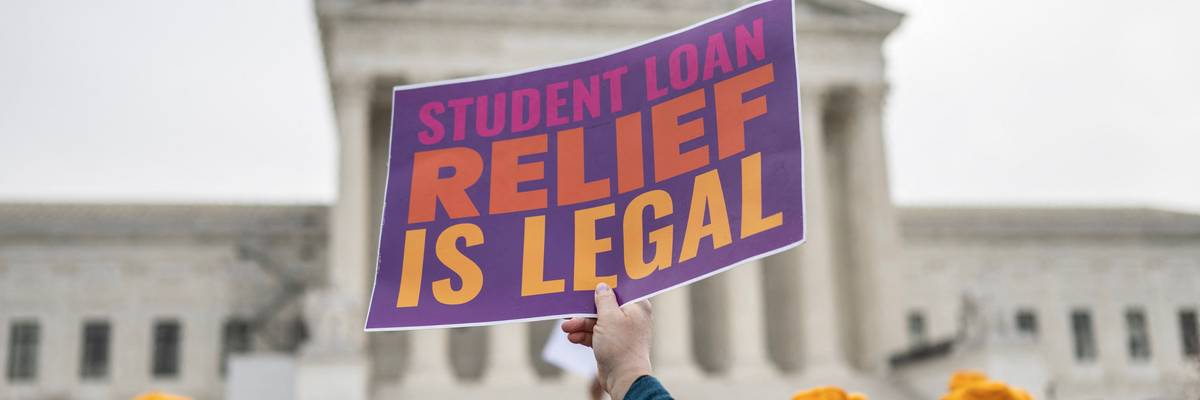 Activists and students protest in front of the Supreme Court during a rally for student debt cancellation
