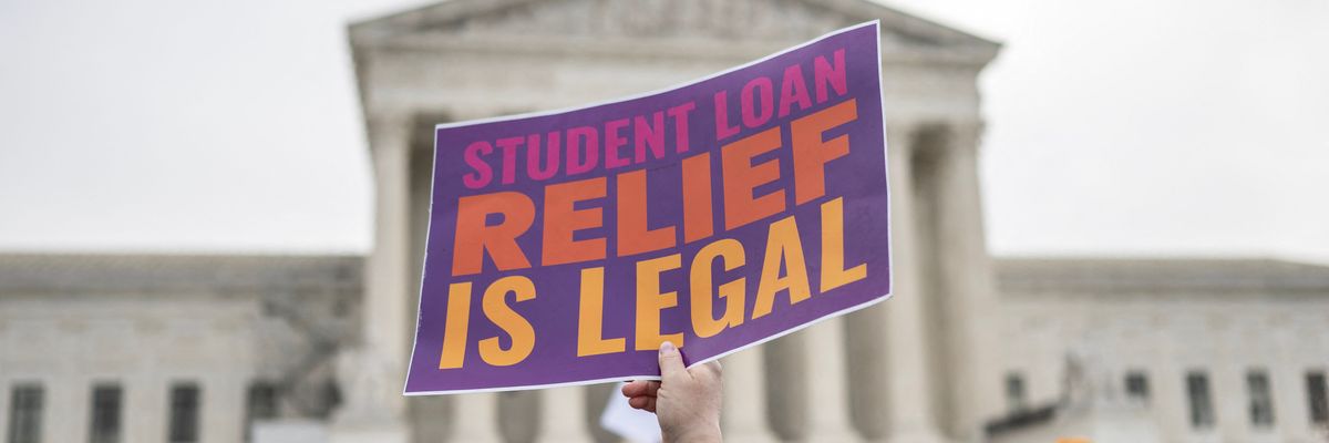 Activists and students protest in front of the Supreme Court during a rally for student debt cancellation