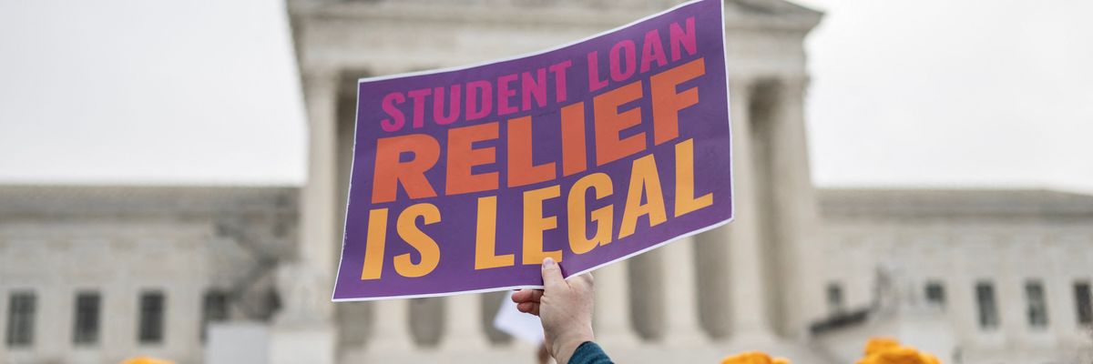 Activists and students protest in front of the Supreme Court during a rally for student debt cancellation