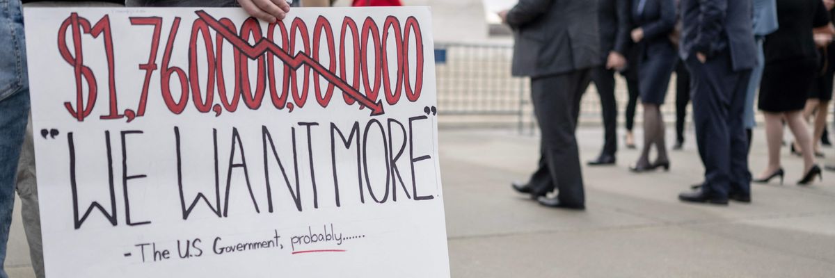 Activists and students protest in front of the Supreme Court during a rally for student debt cancellation