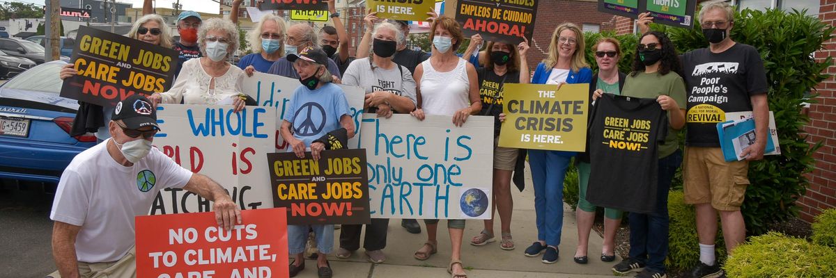 Activists attend the Rally to #SealTheDeal for Climate, Jobs, Care, and Justice on August 19, 2021 in Patchogue, New York