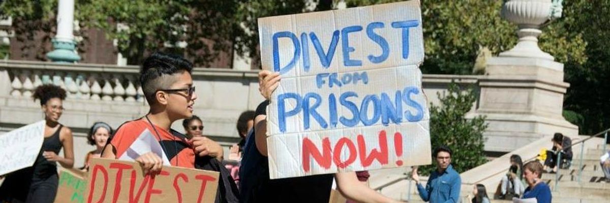 Activists call for divestment from the prison industry at the Columbia Prison Divest and Coalition Against Gentrification - CAGe's action on the World Leader's Forum at Columbia University on September 26th, 2014