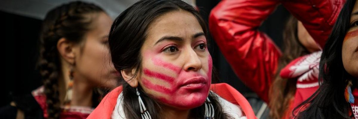 Activists demonstrated outside the U.S. Embassy in Madrid