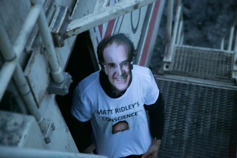 Activists donned masks of the aristocrat, land-owner, and climate-skeptic Matt Ridley