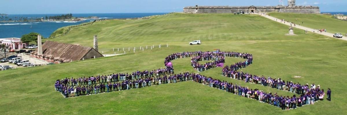 Activists form a ribbon with their bodies at a Spanish fort in Puerto Rico.