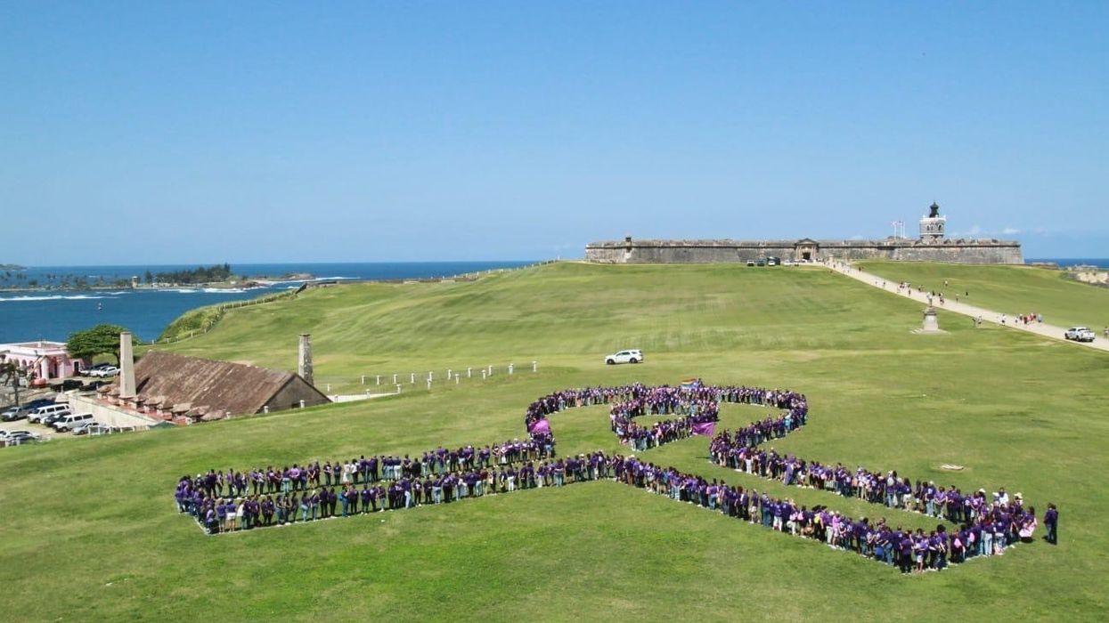 Activists form a ribbon with their bodies at a Spanish fort in Puerto Rico.