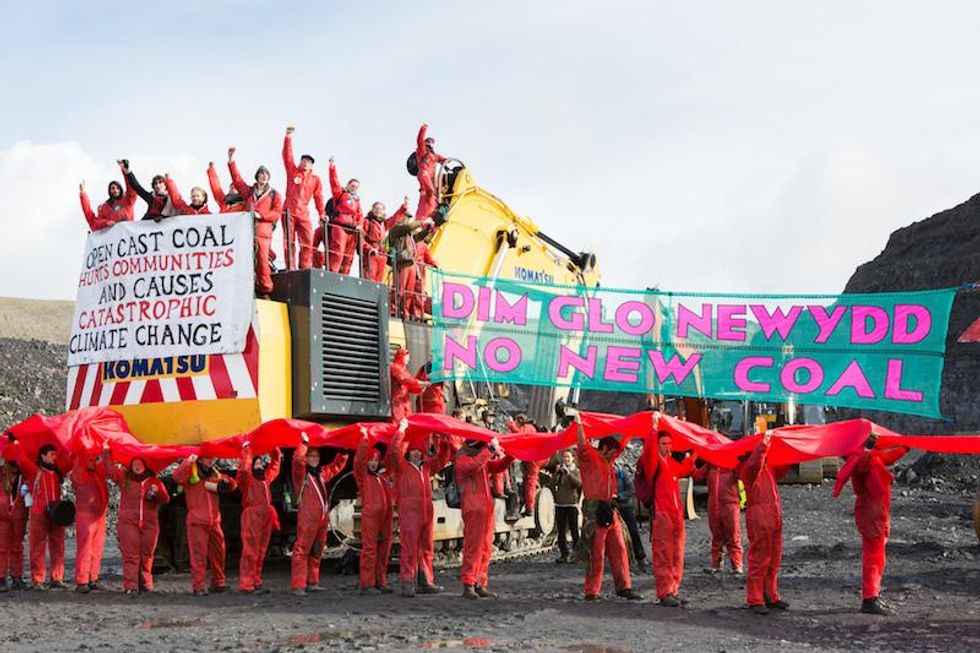 Activists from Reclaim The Power's End Coal Now camp occupy and halt work in the UK's largest open cast coal mine, Friss Y Fran.