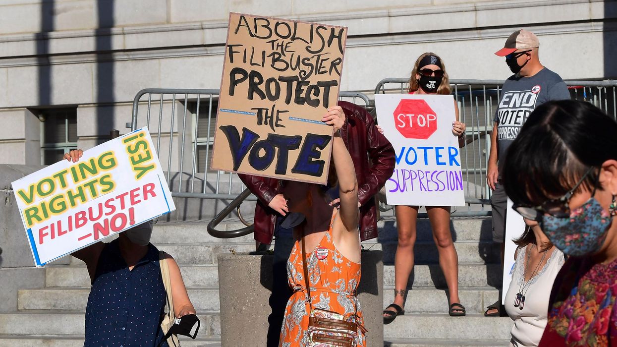Activists from various grassroots organizations rally outside City Hall in Los Angeles on July 7, 2021, calling on Sen. Dianne Feinstein (D-Calif.) and other senators to remove the filibuster and pass the "For the People Act" to expand voting rights. (Photo: Frederic J. Brown/AFP via Getty Images)