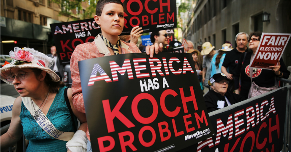 Activists hold a protest near the Manhattan apartment of billionaire and Republican financier David Koch in New York City. (Photo: Spencer Platt/Getty Images)