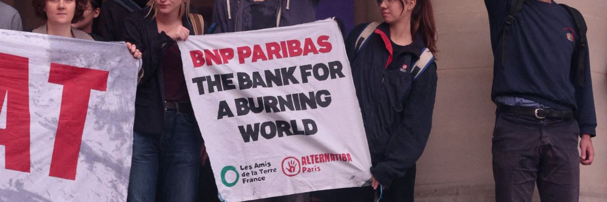 Activists participate in a demonstration in Paris