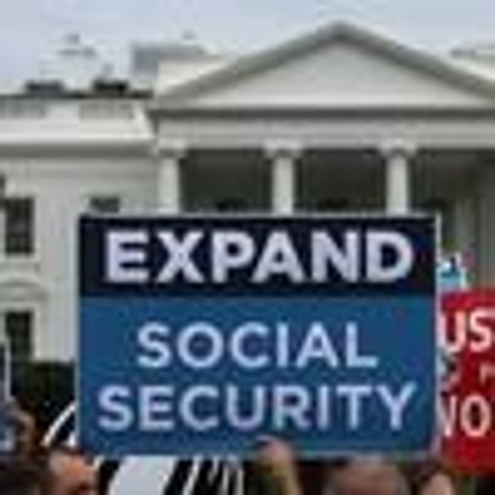 Activists participate in a rally urging the expansion of Social Security benefits in front of the White House July 13, 2015