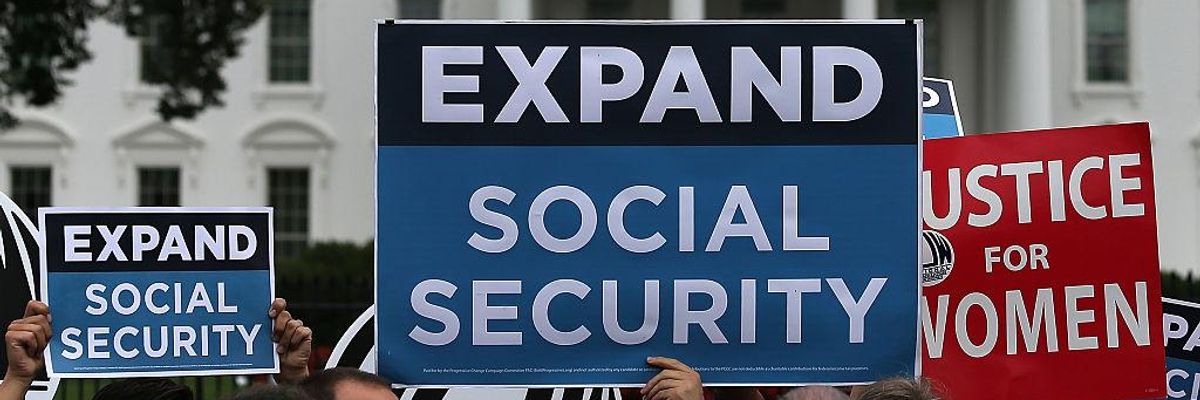 Activists participate in a rally urging the expansion of Social Security benefits in front of the White House on July 13, 2015 in Washington, D.C.
