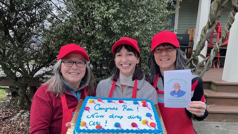 Activists present a sheet cake to Costco's CEO.