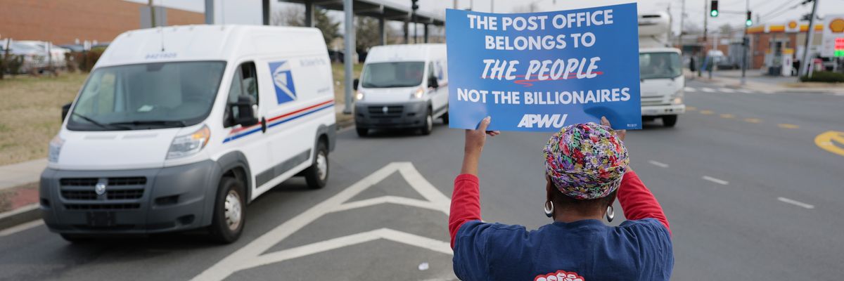 Activists protest during a "U.S. Mail Not For Sale" rally