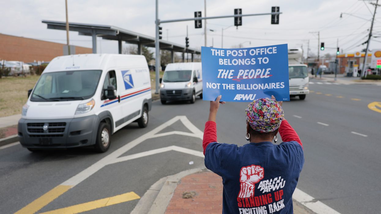 Activists protest during a "U.S. Mail Not For Sale" rally
