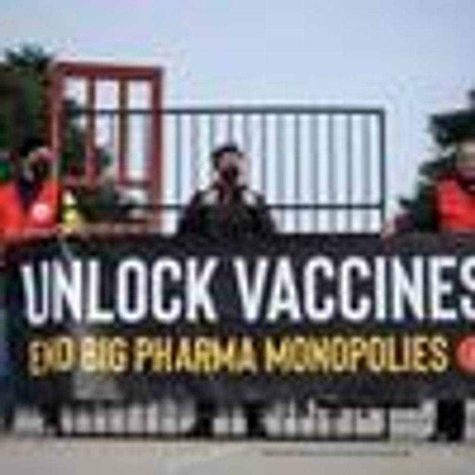 Activists protest in favor of an agreement to waive patent protections for Covid-19 vaccines on November 30, 2021 in Geneva.