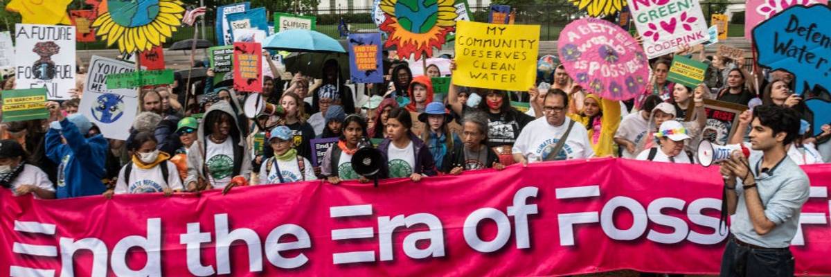Activists protest in front of the White House on Earth Day 2023