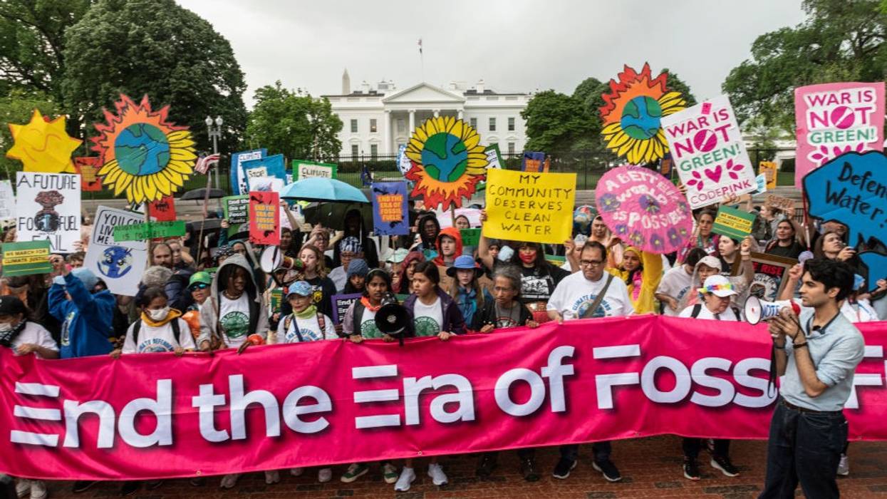 Activists protest in front of the White House on Earth Day 2023