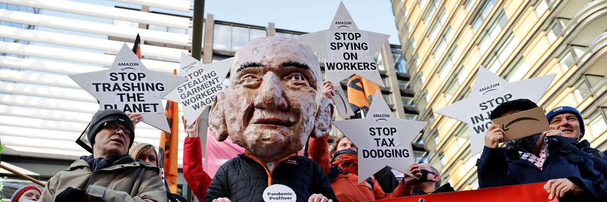 Activists protest outside of Amazon's headquarters in central London on November 26, 2021