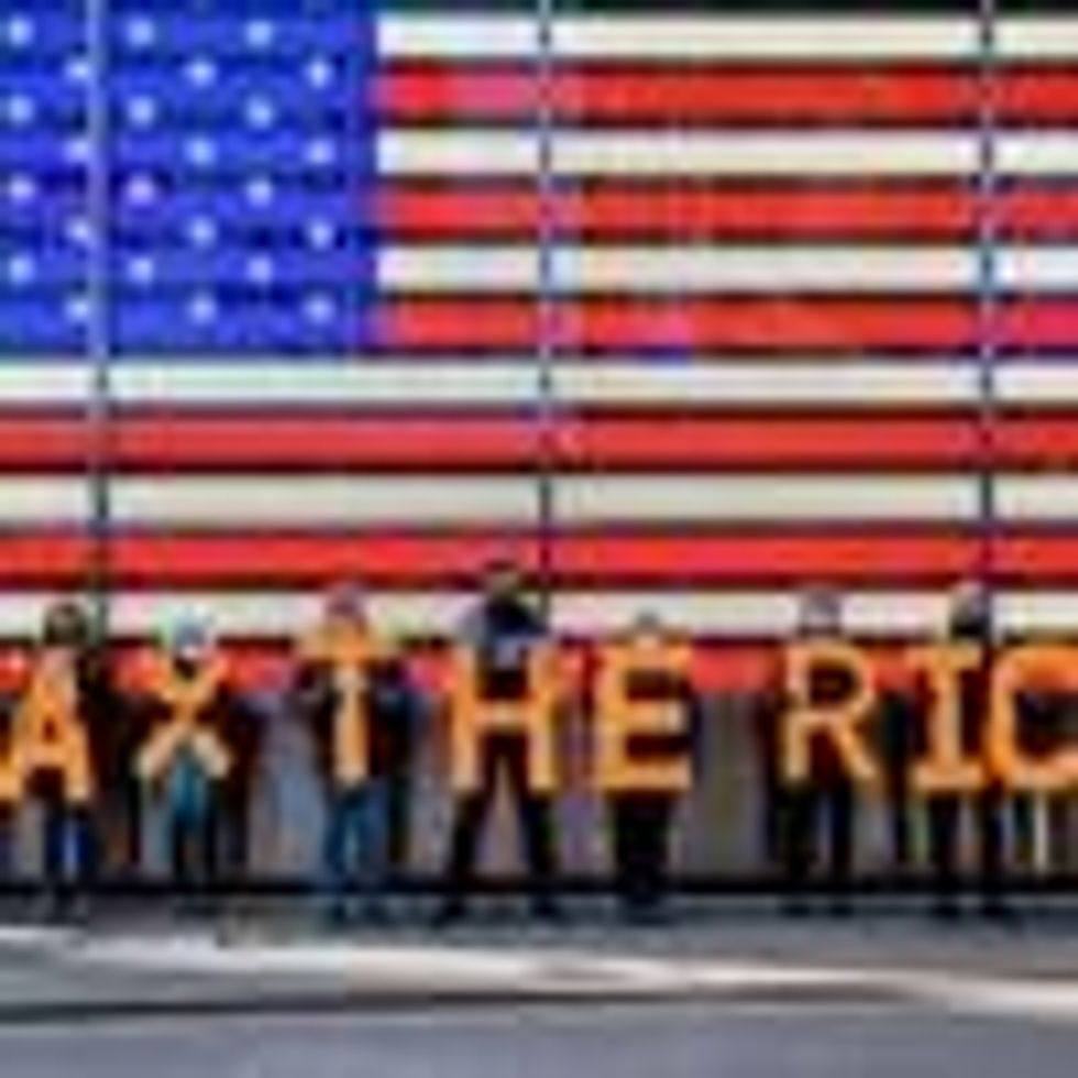 Activists spell out #TaxTheRich at Times Square in New York City. (Photo: Erik McGregor/LightRocket via Getty Images)