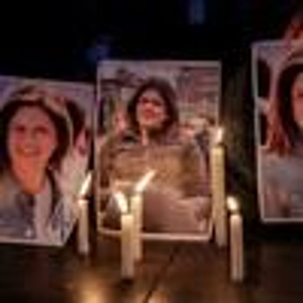 Activists take part in a candlelight vigil outside the U.N.'s Economic and Social Commission for West Asia building in Beirut to denounce the killing of Al Jazeera reporter Shireen Abu Akleh