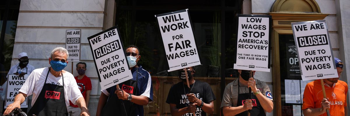 Activists take part in a “Wage Strike" demonstration