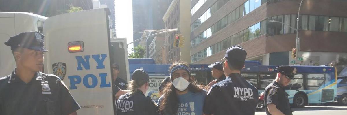 Activists were arrested in New York City on August 18, 2022 after demonstrating outside Senate Majority Leader Chuck Schumer's (D-N.Y.) Manhattan office, where they expressed opposition to the fossil fuel-friendly permitting reforms he agreed to bring to the floor to secure Sen. Joe Manchin's (D-W.Va.) support for the Inflation Reduction Act.